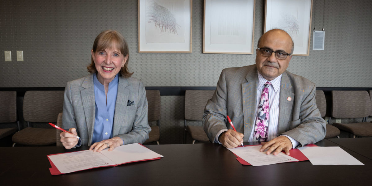 Dr. Johnson and Dr. Deeb sign MOU