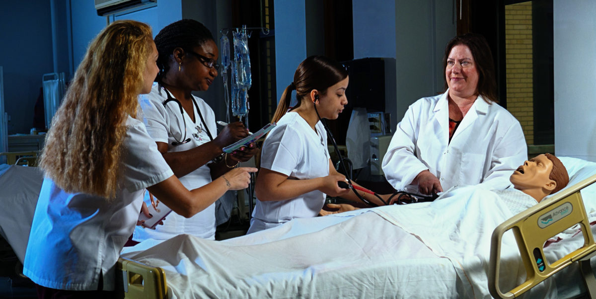 Nursing students in a healthcare lab environment